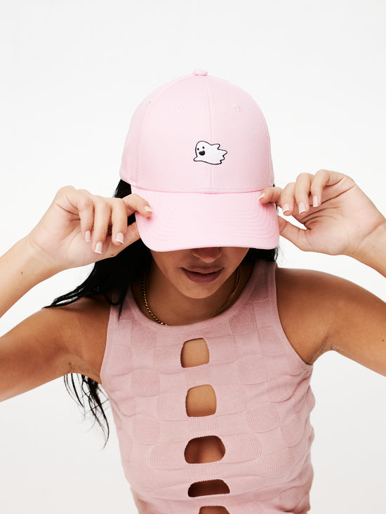 MOOD Caps model wearing Flying Ghost Baseball Cap in Cotton Candy Color