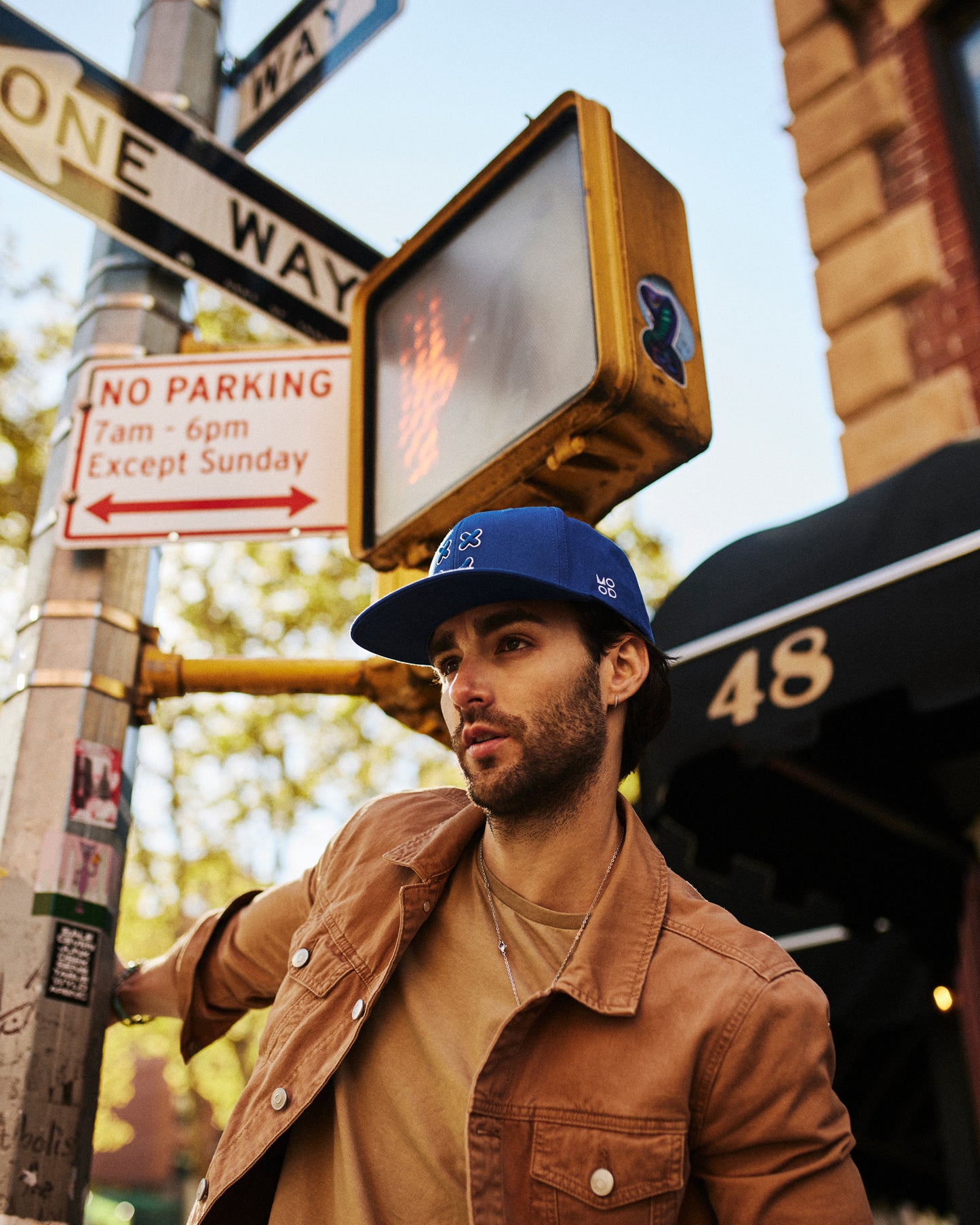 MOOD Caps model wearing XX OG baseball cap flat brim in loyal blue color chillin in New York