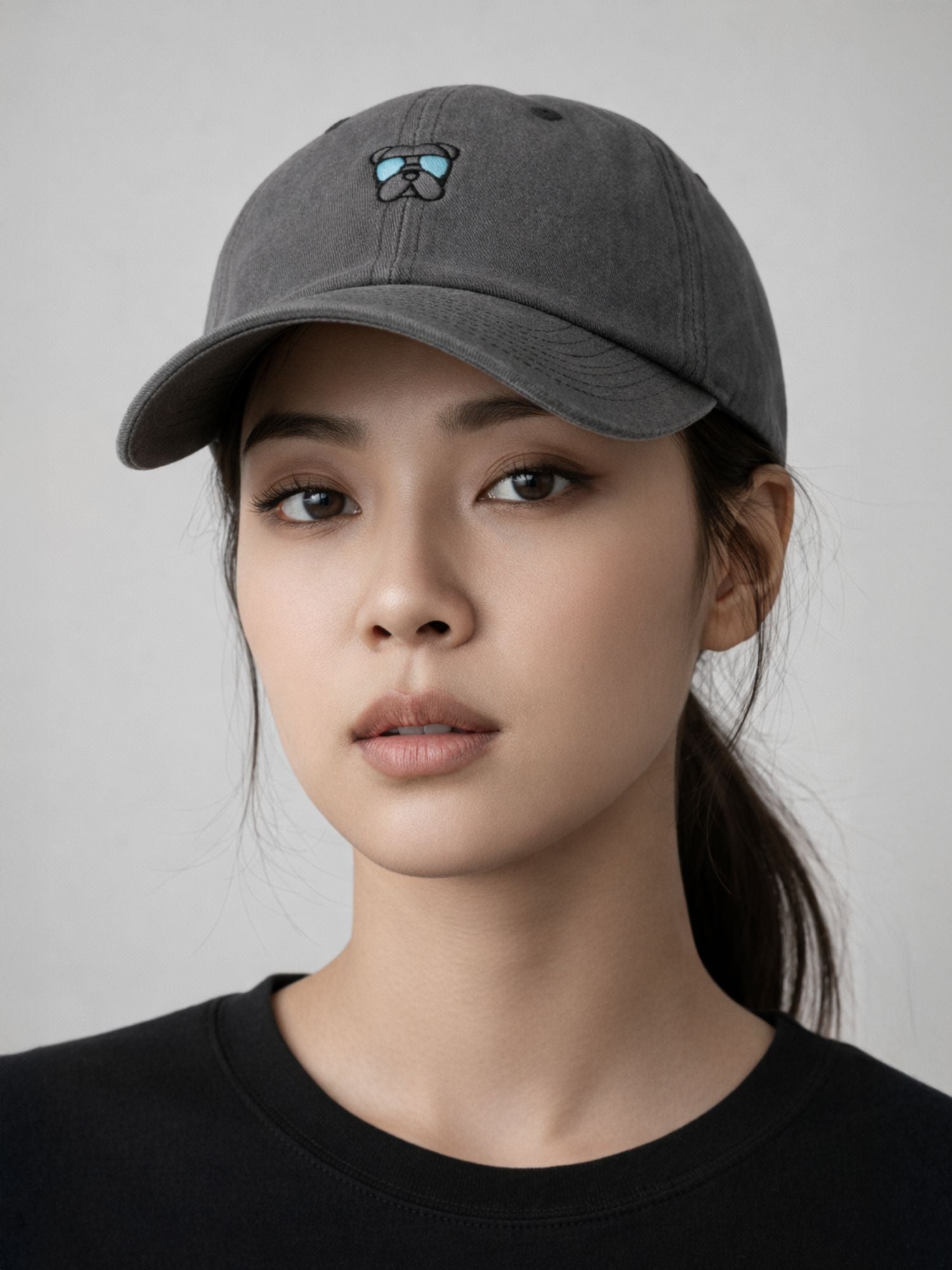 Female model wearing MOOD gray baseball cap Woof