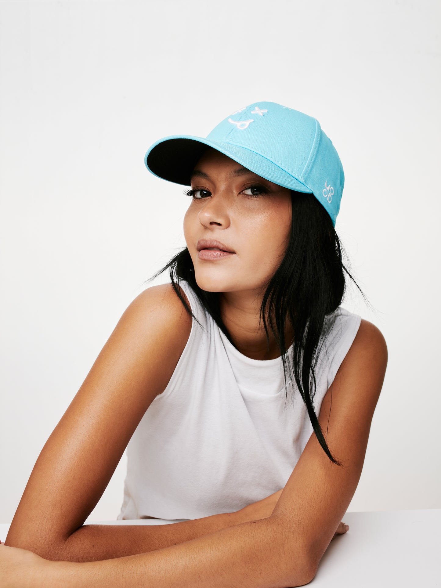 MOOD female model wearing XX baseball cap in paradise blue