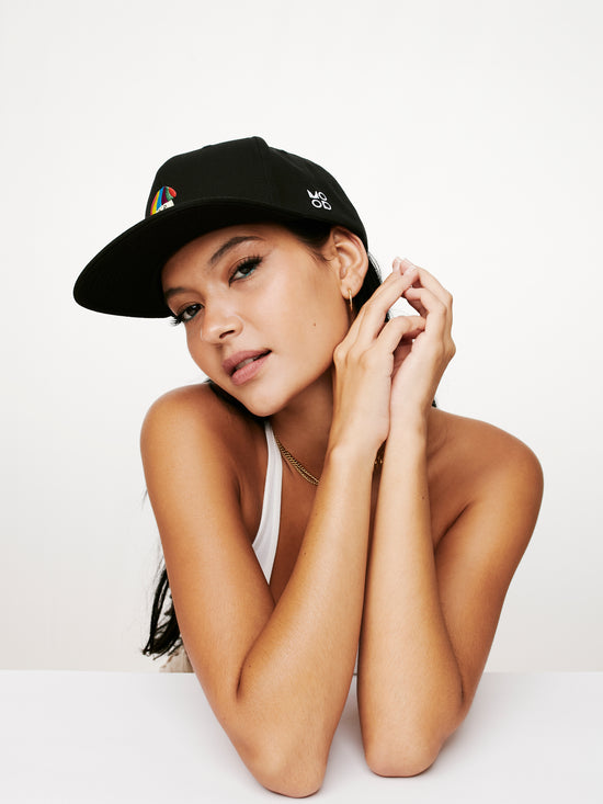 MOOD female model looking fly in MOOD's shroom OG flat brim baseball cap