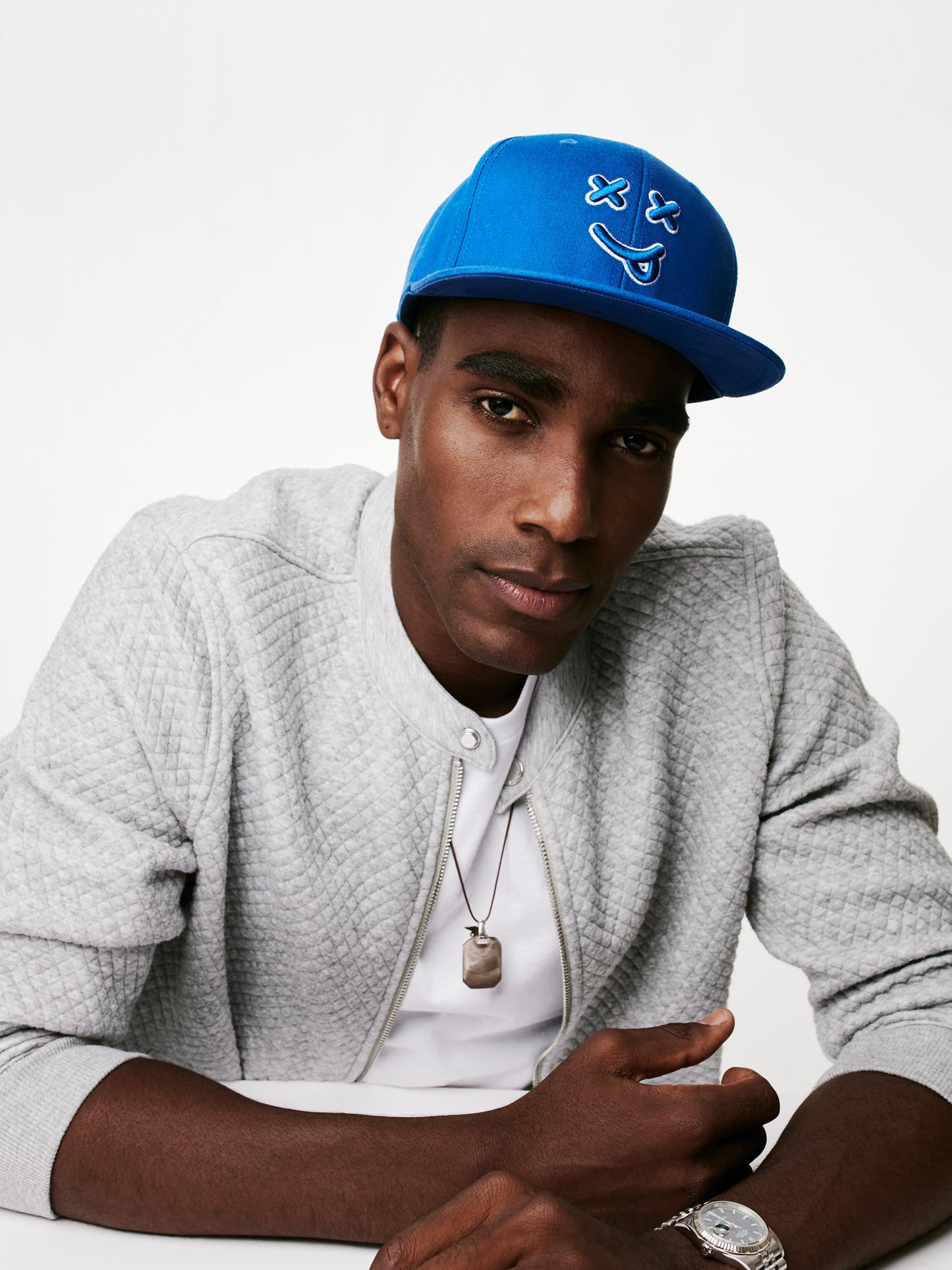 MOOD male model wearing XX OG flat brim baseball cap in loyal blue looking good