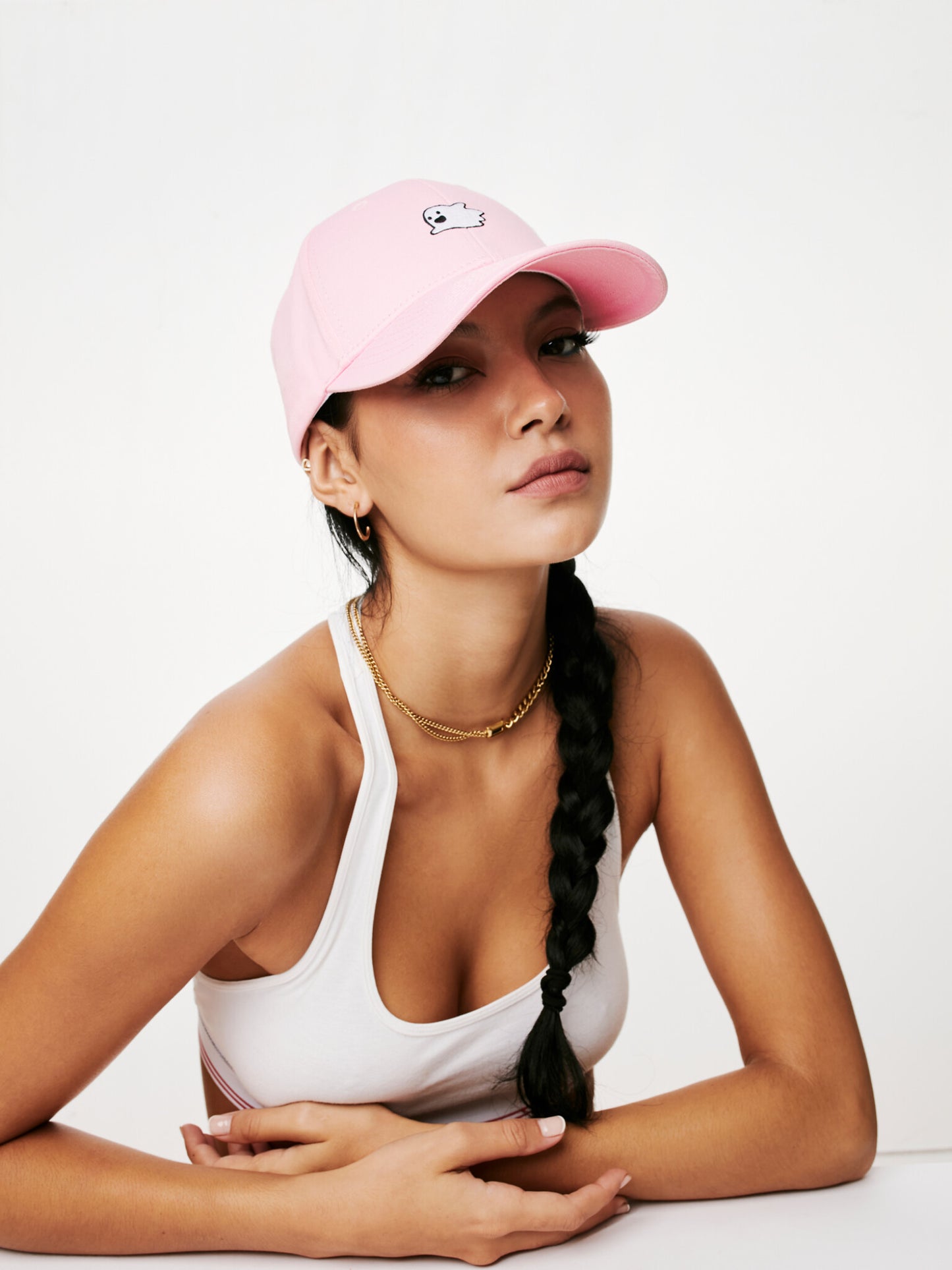 MOOD female model wearing Flying Ghost baseball cap in pink color looking stylish
